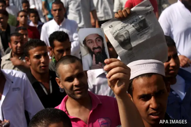 Egyptian Islamists, carrying a picture of late Al-Qaeda chief Osama bin Laden, march to the US embassy after the weekly Friday prayer in Cairo on May 6, 2011, during a demonstration to denounce the killing of Osama bin L...