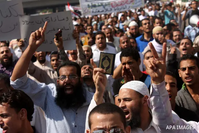 Egyptian Islamists shout slogans during a march to the US embassy after the weekly Friday prayer in Cairo on May 6, 2011, during a demonstration to denounce the killing of Osama bin Laden by US forces in Pakistan. Photo...