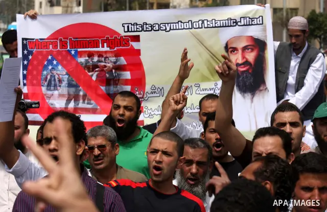 Egyptian Islamists, carrying a picture of late Al-Qaeda chief Osama bin Laden, march to the US embassy after the weekly Friday prayer in Cairo on May 6, 2011, during a demonstration to denounce the killing of Osama bin L...