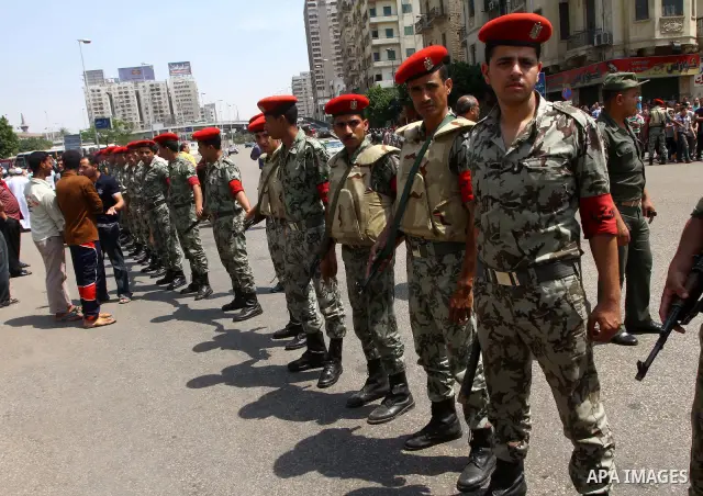 Egyptian forces stand guard as Islamists march to the US embassy after the weekly Friday prayer in Cairo on May 6, 2011, during a demonstration to denounce the killing of Osama bin Laden by US forces in Pakistan. Photo b...