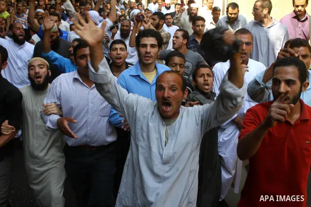 Egyptian Islamists shout slogans during a march to the US embassy after the weekly Friday prayer in Cairo on May 6, 2011, during a demonstration to denounce the killing of Osama bin Laden by US forces in Pakistan. Photo...