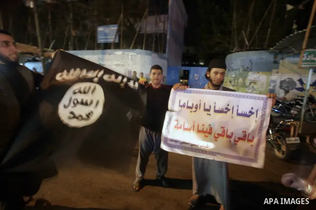 Palestinian Salafi group holds a picture of Osama bin Laden, during a protest in Rafah, southern Gaza Strip, Friday, May 6, 2011. Al-Qaida on Friday confirmed the killing of Osama bin Laden and warned of retaliation, say...