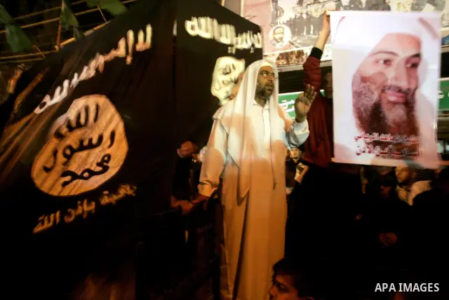 Palestinian Salafi group holds a picture of Osama bin Laden, during a protest in Rafah, southern Gaza Strip, Friday, May 6, 2011. Al-Qaida on Friday confirmed the killing of Osama bin Laden and warned of retaliation, say...