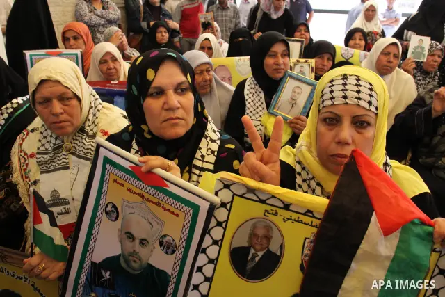 Palestinians hold pictures of jailed relatives during a protest in Gaza city calling for their release from Israeli prisons on Mayl 7, 2011. Photo by Mohamad Asad