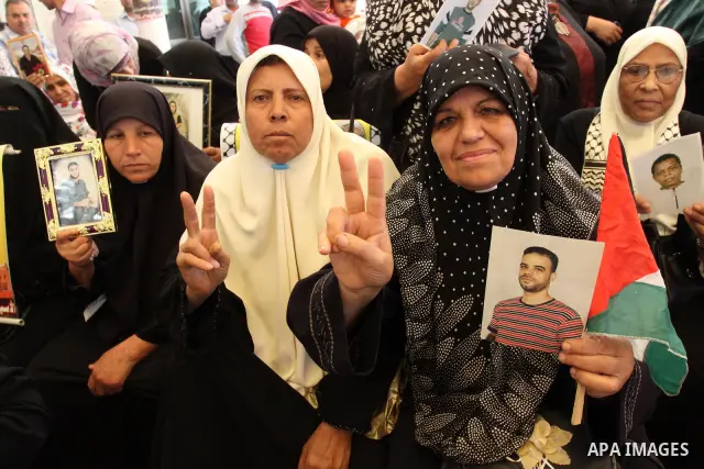 Palestinians hold pictures of jailed relatives during a protest in Gaza city calling for their release from Israeli prisons on Mayl 7, 2011. Photo by Mohamad Asad