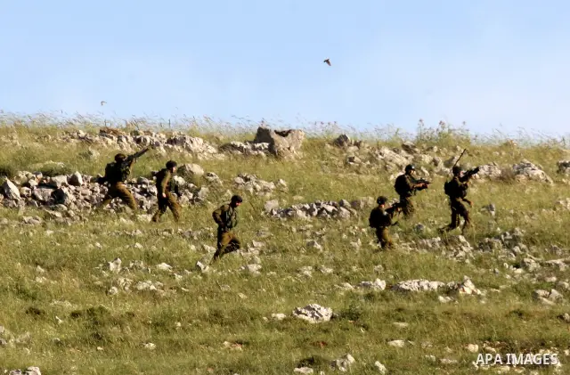 Israeli soldiers take position during the clashes with Palestinian youths following a demonstration against Jewish settlements in the northern West Bank village of Iraq Burin on May 7, 2011. Photo by Wagdi Eshtayah