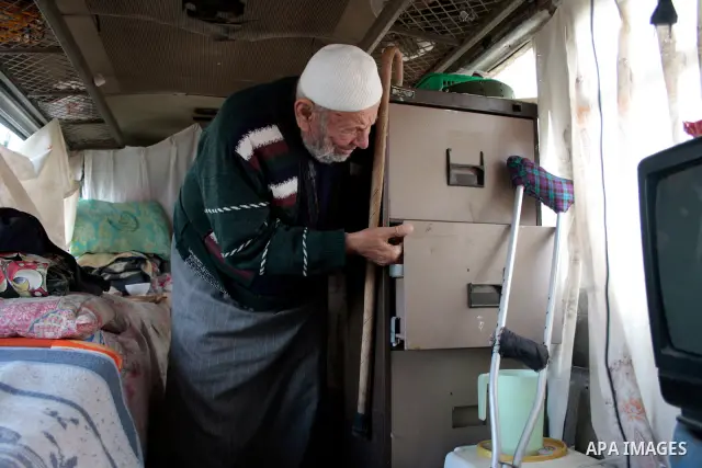 A Palestinian Sheikh Abed el-Haseeb Zaloum, 78 years, lives in a damaged bus, since his house was demolished before ten years by Israeli bulldozers near the Jewish settlement of Karyat Arbaa, in the West Bank city of Heb...