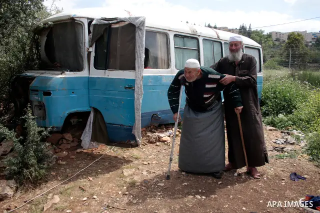 A Palestinian Sheikh Abed el-Haseeb Zaloum, 78 years, lives in a damaged bus, since his house was demolished before ten years by Israeli bulldozers near the Jewish settlement of Karyat Arbaa, in the West Bank city of Heb...