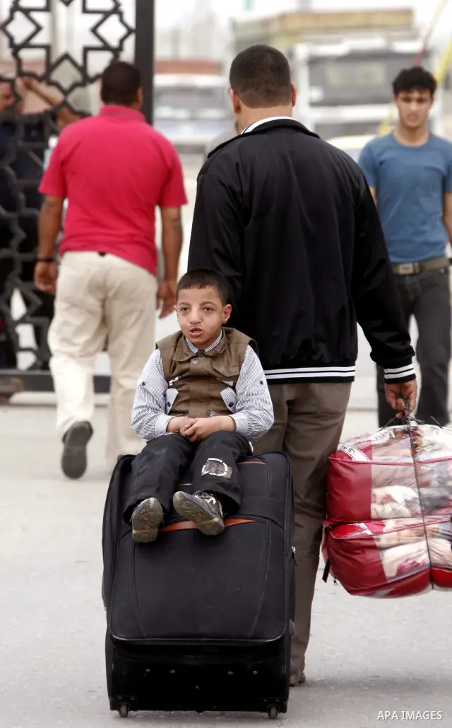Palestinians arrive at their side of the Rafah border crossing with Egypt in the southern Gaza Strip on May 8, 2011. photo by Abed Rahim Khatib