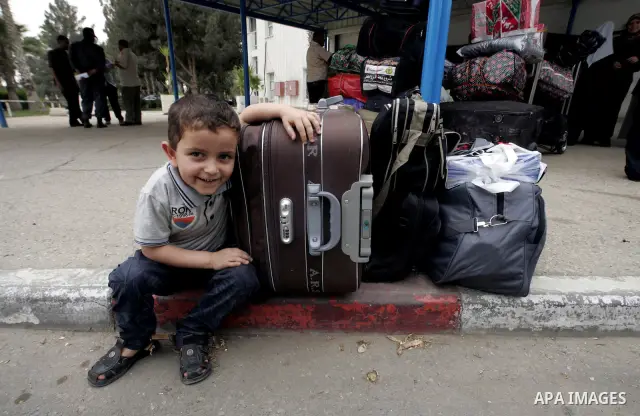 Palestinians arrive at their side of the Rafah border crossing with Egypt in the southern Gaza Strip on May 8, 2011. photo by Abed Rahim Khatib