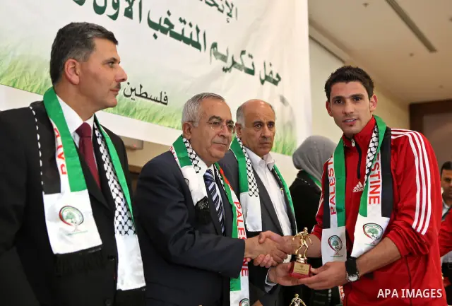 Palestinian Prime Minister, Salam Fayyad honors the members of the Olympic National team in the West Bank city of Ramallah on May 8, 2011. Photo by Mustafa Abu Dayeh