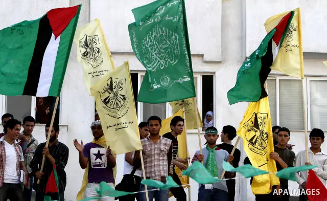 Palestinians participate in a rally celebrating the reconciliation agreement between Fatah and Hamas, at al-Azhar University in Gaza City, Sunday, May 8, 2011. Rival Palestinian factions Fatah and Hamas signed a landmark...