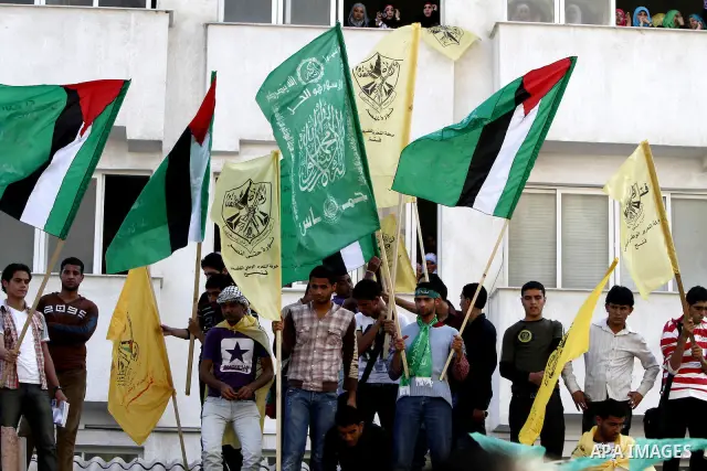 Palestinians participate in a rally celebrating the reconciliation agreement between Fatah and Hamas, at al-Azhar University in Gaza City, Sunday, May 8, 2011. Rival Palestinian factions Fatah and Hamas signed a landmark...