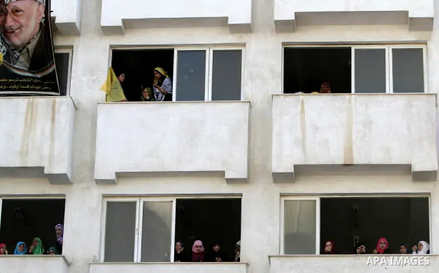 Palestinians participate in a rally celebrating the reconciliation agreement between Fatah and Hamas, at al-Azhar University in Gaza City, Sunday, May 8, 2011. Rival Palestinian factions Fatah and Hamas signed a landmark...