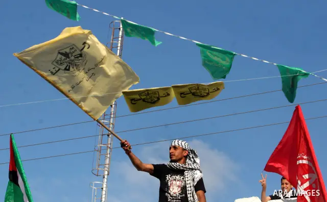 Palestinians participate in a rally celebrating the reconciliation agreement between Fatah and Hamas, at al-Azhar University in Gaza City, Sunday, May 8, 2011. Rival Palestinian factions Fatah and Hamas signed a landmark...