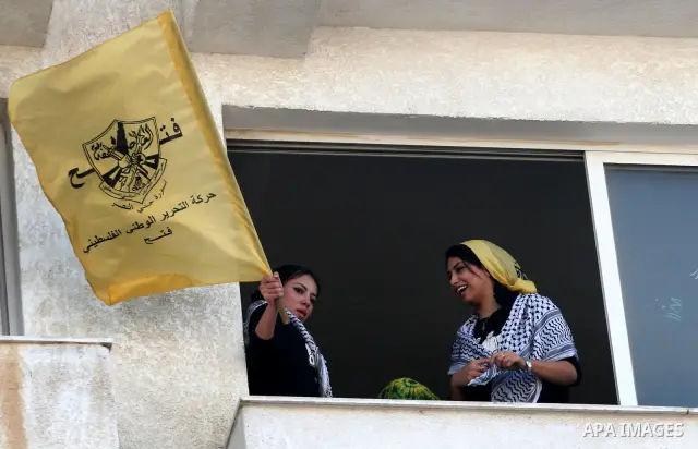 Palestinians participate in a rally celebrating the reconciliation agreement between Fatah and Hamas, at al-Azhar University in Gaza City, Sunday, May 8, 2011. Rival Palestinian factions Fatah and Hamas signed a landmark...