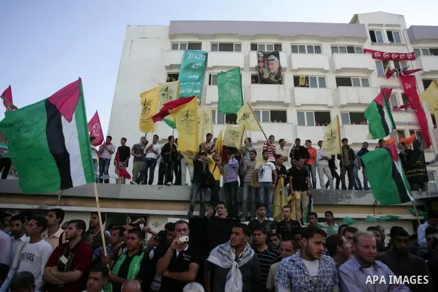Palestinians participate in a rally celebrating the reconciliation agreement between Fatah and Hamas, at al-Azhar University in Gaza City, Sunday, May 8, 2011. Rival Palestinian factions Fatah and Hamas signed a landmark...