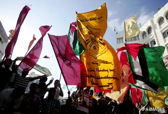 Palestinians participate in a rally celebrating the reconciliation agreement between Fatah and Hamas, at al-Azhar University in Gaza City, Sunday, May 8, 2011. Rival Palestinian factions Fatah and Hamas signed a landmark...