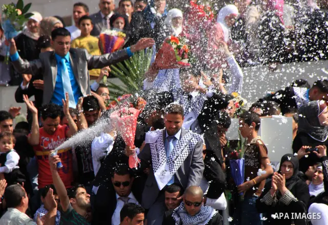Palestinian students from the Fatah movement take part in a rally during their graduation ceremony at A-Najah University in the West Bank city of Nablus, Sunday, May 8, 2011. Photo by Wagdi Eshtayah