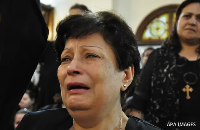 Christian woman mourns during the funeral of a victim of sectarian clashes in Cairo on May 8, 2011 as Egypt's military rulers warned they will use an "iron hand" to protect national security after clashes between Muslims...