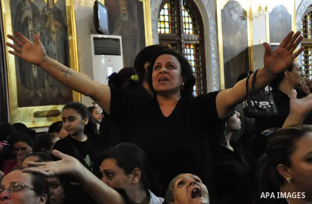 Christian woman mourns during the funeral of a victim of sectarian clashes in Cairo on May 8, 2011 as Egypt's military rulers warned they will use an "iron hand" to protect national security after clashes between Muslims...