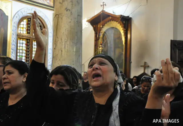 Christian woman mourns during the funeral of a victim of sectarian clashes in Cairo on May 8, 2011 as Egypt's military rulers warned they will use an "iron hand" to protect national security after clashes between Muslims...