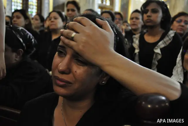 Christian woman mourns during the funeral of a victim of sectarian clashes in Cairo on May 8, 2011 as Egypt's military rulers warned they will use an "iron hand" to protect national security after clashes between Muslims...