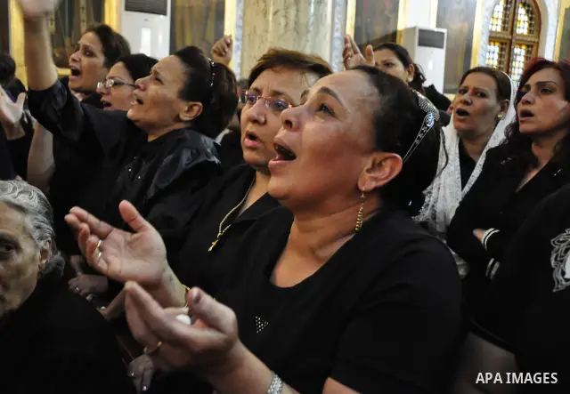 Christian woman mourns during the funeral of a victim of sectarian clashes in Cairo on May 8, 2011 as Egypt's military rulers warned they will use an "iron hand" to protect national security after clashes between Muslims...