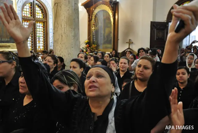 Christian woman mourns during the funeral of a victim of sectarian clashes in Cairo on May 8, 2011 as Egypt's military rulers warned they will use an "iron hand" to protect national security after clashes between Muslims...