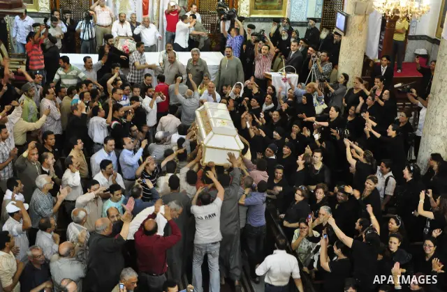 Egyptian Coptic Christians carry the coffin of a victim of sectarian clashes during a funeral in Cairo on May 8, 2011 as Egypt's military rulers warned they will use an "iron hand" to protect national security after clas...