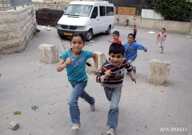 Palestinians children play in the street in the East Jerusalem neighborhood of Silwan, on May 08, 2011. Photo by Mahfouz Abu Turk