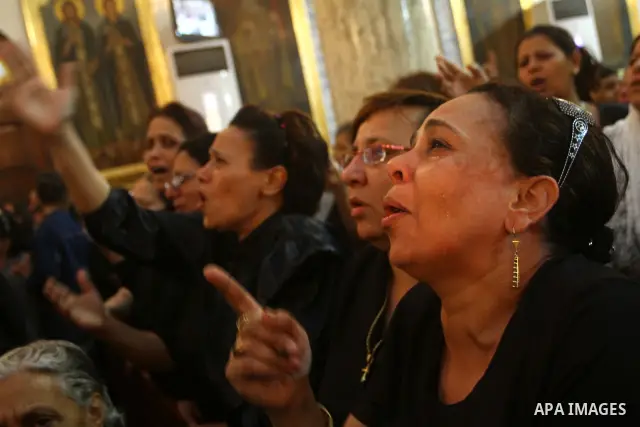 Egyptian Coptic Christian women mourn during the funeral of a victim of sectarian clashes in Cairo on May 8, 2011 as Egypt's military rulers warned they will use an "iron hand" to protect national security after clashes...
