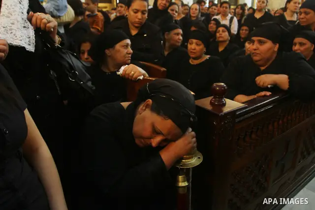 Egyptian Coptic Christian women mourn during the funeral of a victim of sectarian clashes in Cairo on May 8, 2011 as Egypt's military rulers warned they will use an "iron hand" to protect national security after clashes...