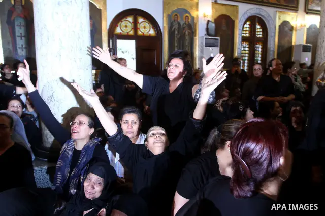 Egyptian Coptic Christian women mourn during the funeral of a victim of sectarian clashes in Cairo on May 8, 2011 as Egypt's military rulers warned they will use an "iron hand" to protect national security after clashes...