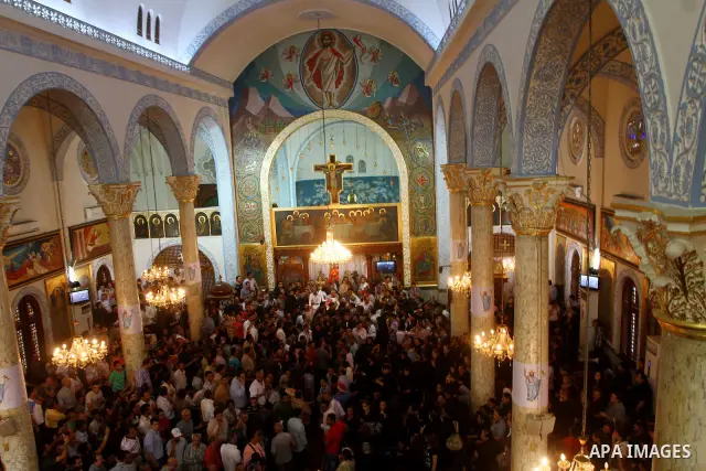 Egyptian Coptic Christians mourn during the funeral of a victim of sectarian clashes in Cairo on May 8, 2011 as Egypt's military rulers warned they will use an "iron hand" to protect national security after clashes betwe...