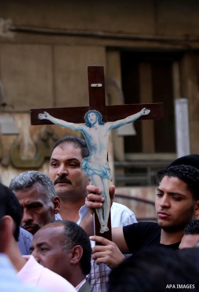 Egyptian Coptic Christians take part in a protest in front of the U.S. embassy in Cairo on May 9, 2011, after clashes between Muslims and Christians in the Egyptian capital killed 12 people and injured scores on May 8,20...