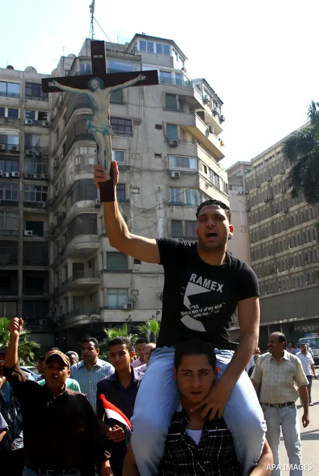 Egyptian Coptic Christians take part in a protest in front of the U.S. embassy in Cairo on May 9, 2011, after clashes between Muslims and Christians in the Egyptian capital killed 12 people and injured scores on May 8,20...