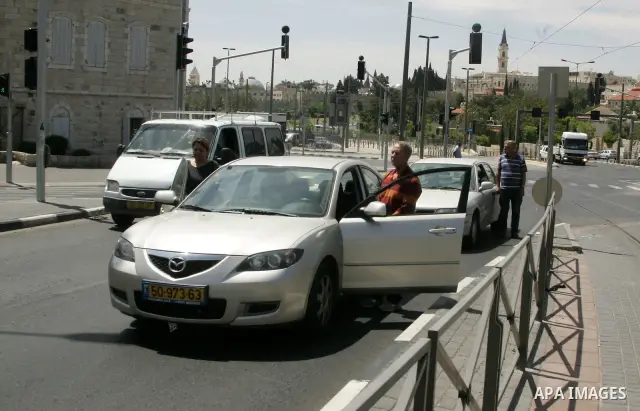 Israelis observe two minutes of silence as a siren wails across the country marking Remembrance Day for the fallen soldiers, in east Jerusalem, on May 9, 2011. Remembrance Day is followed immediately by the 63rd annivers...