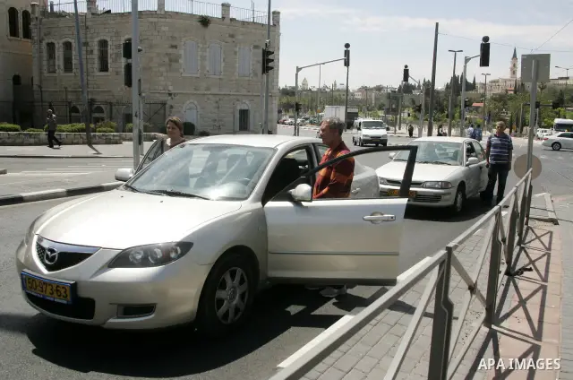Israelis observe two minutes of silence as a siren wails across the country marking Remembrance Day for the fallen soldiers, in east Jerusalem, on May 9, 2011. Remembrance Day is followed immediately by the 63rd annivers...