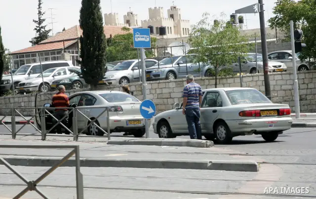 Israelis observe two minutes of silence as a siren wails across the country marking Remembrance Day for the fallen soldiers, in east Jerusalem, on May 9, 2011. Remembrance Day is followed immediately by the 63rd annivers...