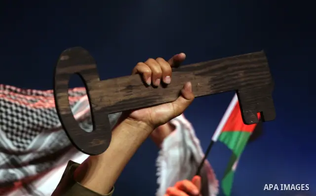 Palestinians hold flags and symbolic keys during a celebration in the West Bank city of Ramallah, Sunday, May 8, 2011 to commemorate the 63rd anniversary of Nakba, or catastrophe, the Arabic term used to describe the upr...