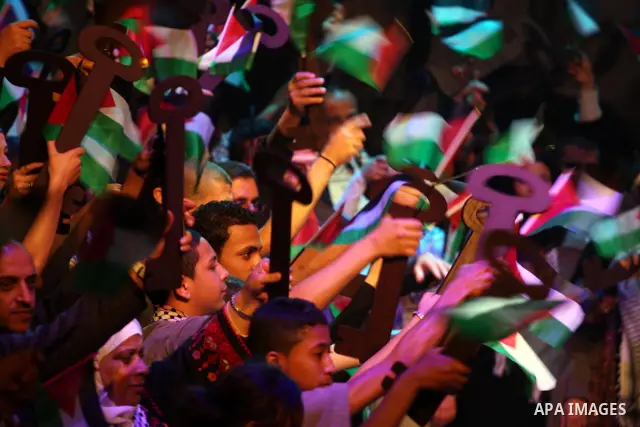 Palestinians hold flags and symbolic keys during a celebration in the West Bank city of Ramallah, Sunday, May 8, 2011 to commemorate the 63rd anniversary of Nakba, or catastrophe, the Arabic term used to describe the upr...