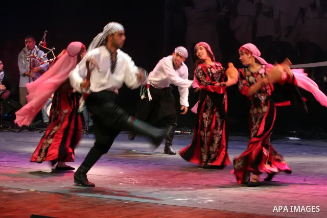 Palestinians, from Lebanon refugee camps, perform traditional dancing Dabka during a celebration at the Cultural Palace in the West Bank city of Ramallah on May 8,2011. Photo by Issam Rimawi