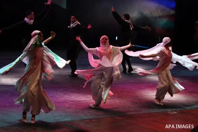 Palestinians, from Lebanon refugee camps, perform traditional dancing Dabka during a celebration at the Cultural Palace in the West Bank city of Ramallah on May 8,2011. Photo by Issam Rimawi