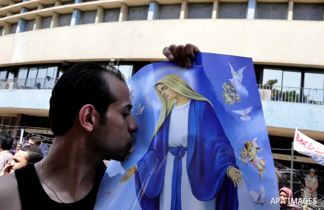 Egyptian Christians protest in front of the state television building in Cairo on May 9, 2011 against recent attempts to trigger sectarian conflict in the country, as the government has vowed to use an "iron fist" to ens...