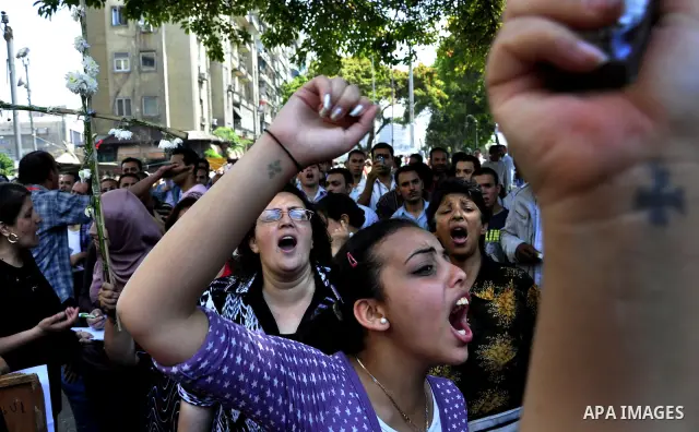 Egyptian Christians protest in front of the state television building in Cairo on May 9, 2011 against recent attempts to trigger sectarian conflict in the country, as the government has vowed to use an "iron fist" to ens...