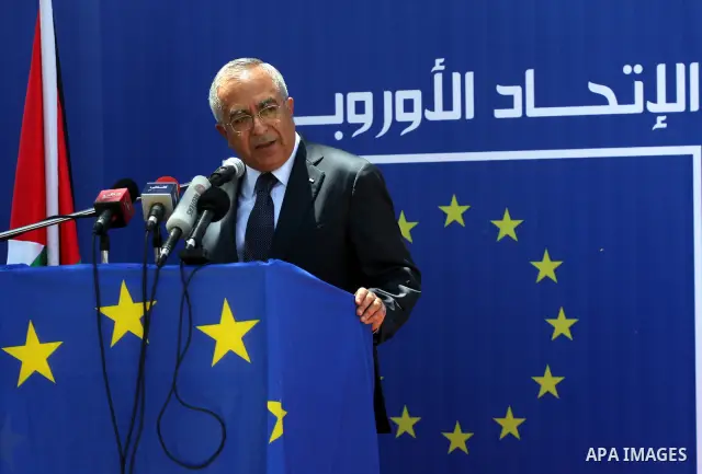 Palestinian Prime Minister, Salam Fayyad participates in a celebration to mark "Europe Day" in the West Bank city of Ramallah on May 9, 2011. France announced it would donate 10 million euros to the Palestinian Authority...