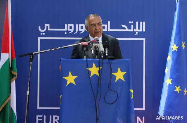 Palestinian Prime Minister, Salam Fayyad participates in a celebration to mark "Europe Day" in the West Bank city of Ramallah on May 9, 2011. France announced it would donate 10 million euros to the Palestinian Authority...