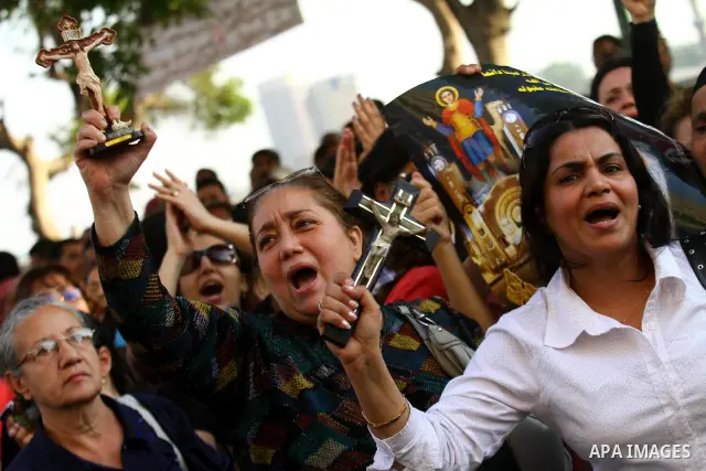 Egyptian Christians protest in front of the state television building in Cairo on May 9, 2011 against recent attempts to trigger sectarian conflict in the country, as the government has vowed to use an "iron fist" to ens...