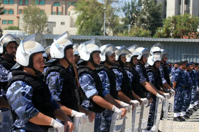 Palestinian Hamas security forces march with their riot gear during a graduation ceremony at the Arafat police compound in Gaza City on May 10, 2011. Photo by Mohammed Othman